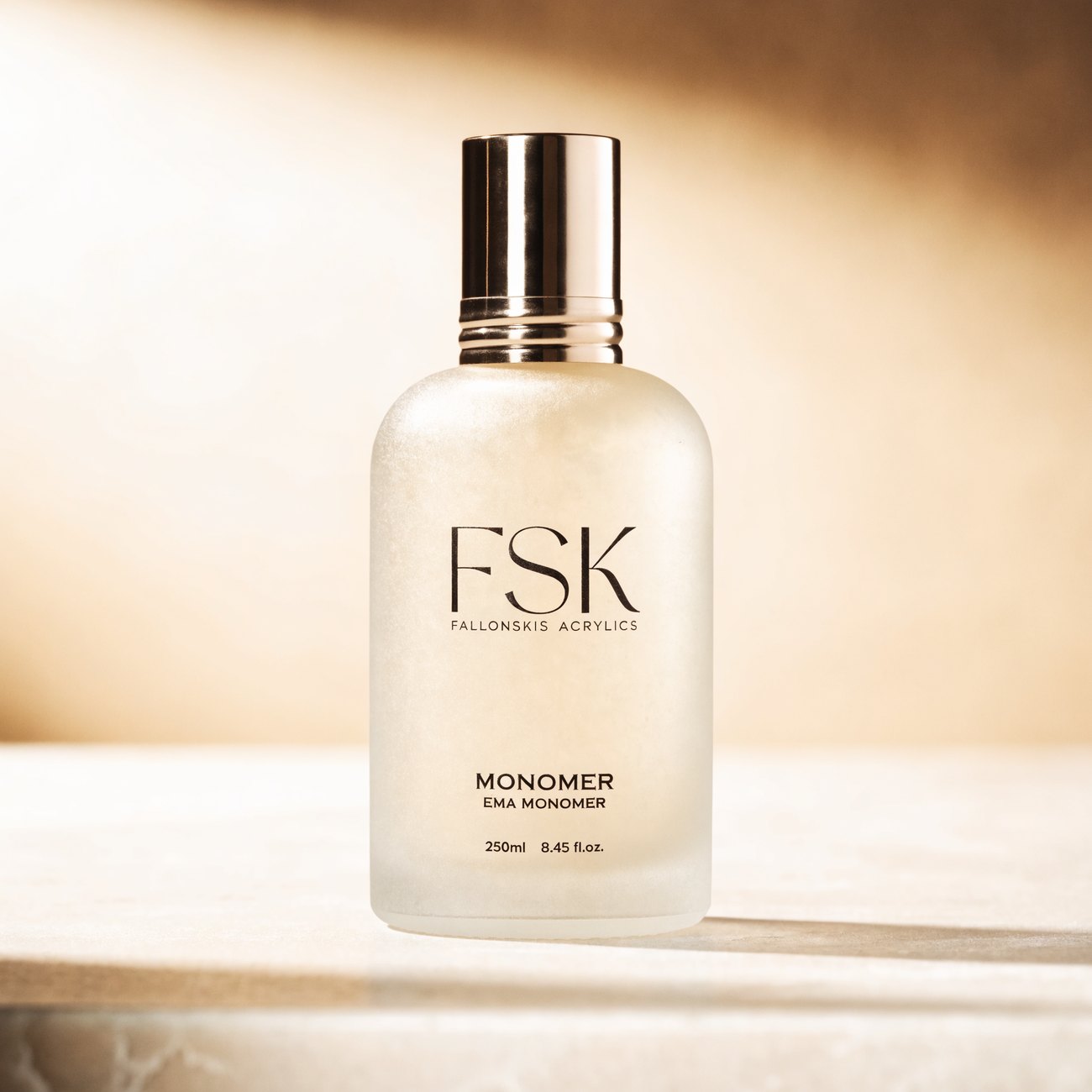 FSK monomer in a frosted bottle with a gold cap