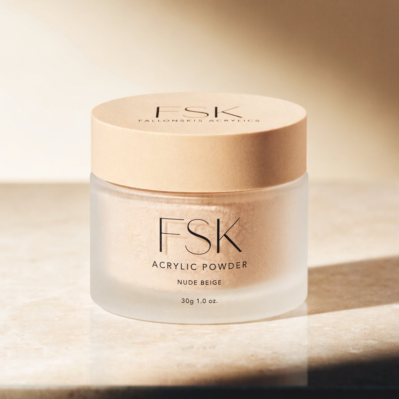 FSK acrylic powder in warm editorial lighting on stone